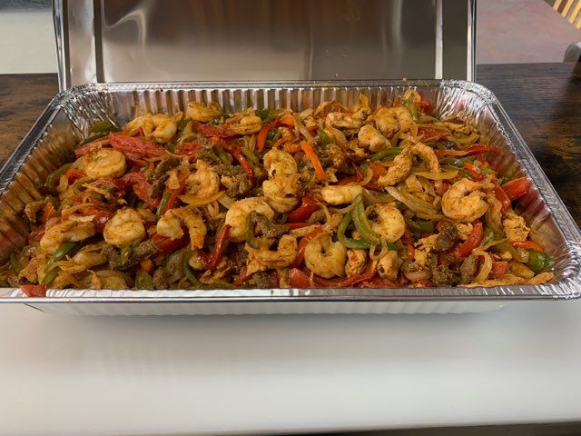 Party tray of seasoned meat and rice from So Sabroso